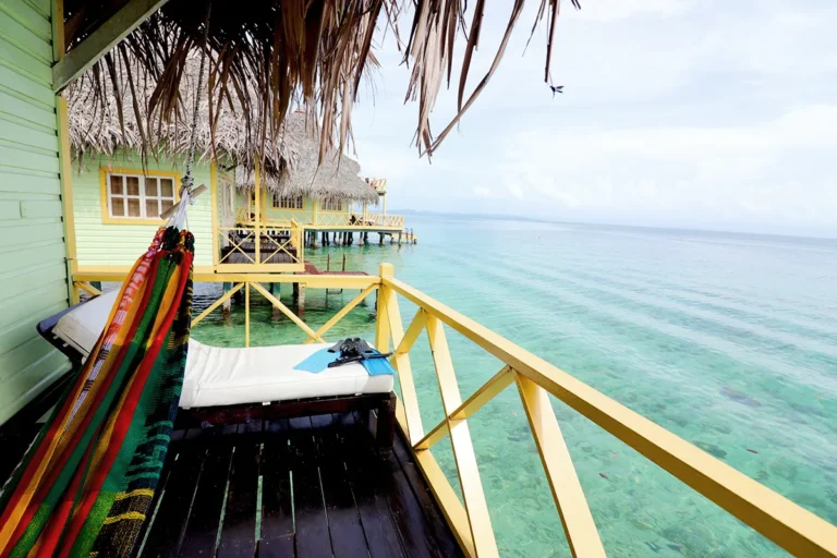 Terrace with a hammock and daybed overlooking the Caribbean Sea