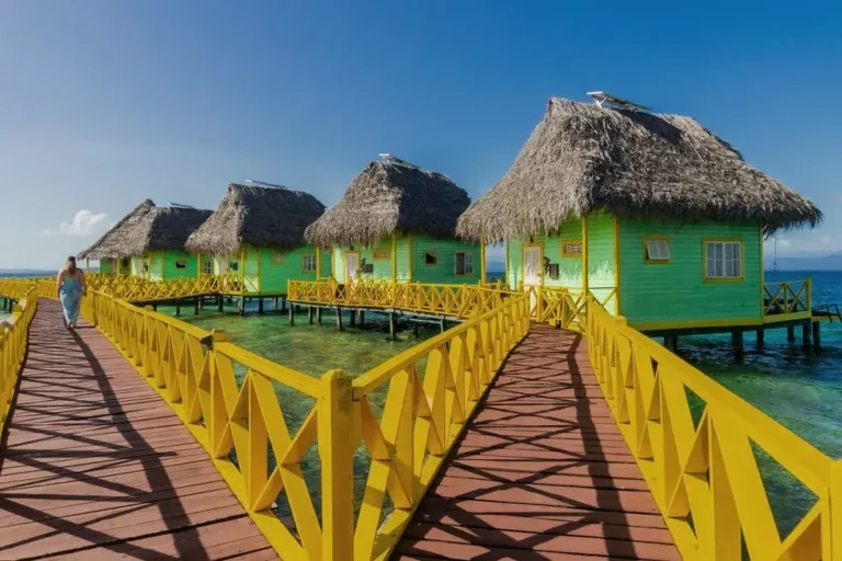 Row of palafitos along the yellow wooden walkway